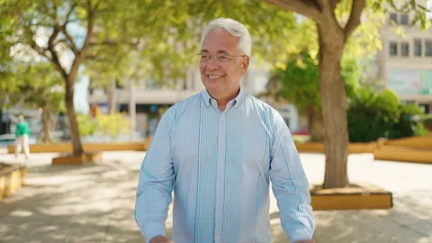 Senior man smiling confident dancing at park Stock Footage 196116214