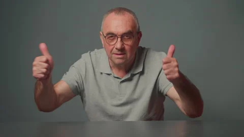 Senior man smiling happy showing two thumb up gesture raised finger approve good Stock Footage 280714100