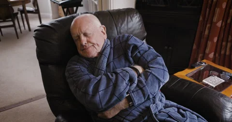 Senior man, sofa and sleeping in living room, resting or nap after Stock Footage 308002005