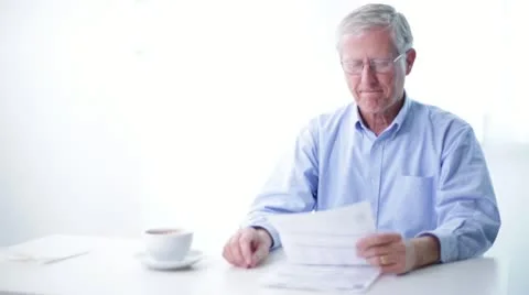 Senior Man Sorting through Mail Stock Footage 20482413