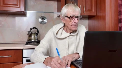 Senior man studying laptop.  E-learning and distant courses Stock Footage 169757716