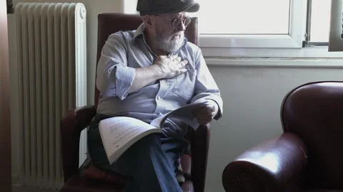 Senior man suffering from heart attack at home. Man clutching his chest Stock Footage 338129439