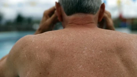 Senior man by a swimming pool. Stock Footage 88405306