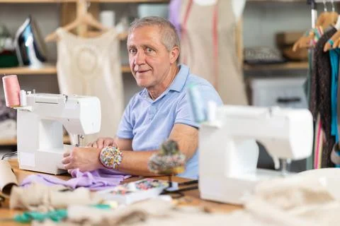 Senior man tailor at work Photos
