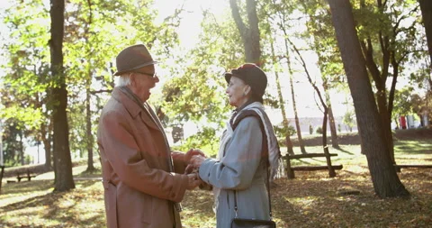 Senior man takes wedding ring out of pocket and puts it on his beloved's finger Stock Footage 133657718