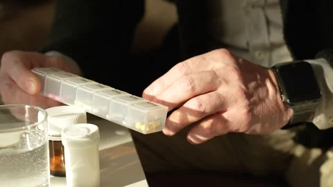 Senior man taking medication, close-up Stock Footage 264841055
