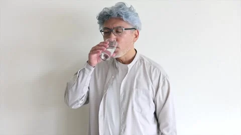 Senior Man Taking Supplement with Glass of Water Stock-Footage 343948469