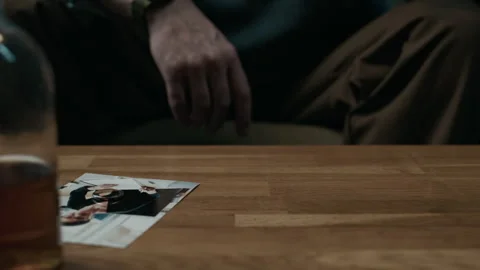 Senior Man Taking Off Wedding Ring and Drinking Alcohol at Home Stock Footage 300598525