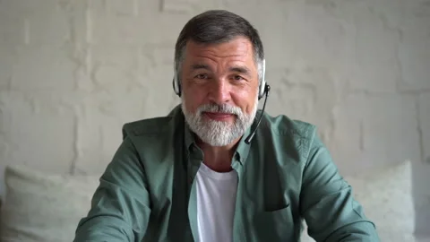 Senior man talking at camera at home, sit on sofa communicating by webcam Stock Footage 158837506