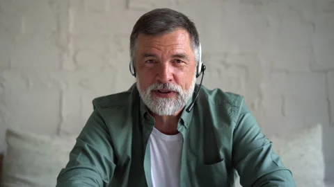 Senior man talking at camera at home, sit on sofa communicating by webcam Stock Footage 158837687