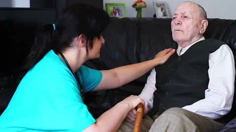 Senior man talking with nurse Stock Footage 24702118