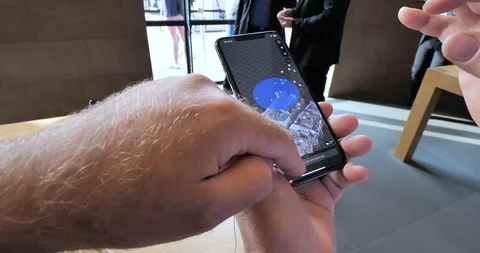 Senior man testing iPhone Xs Stock Footage 95587638