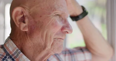 Senior man, thinking and closeup at window for vision, memory or idea for Stock Footage 267060152