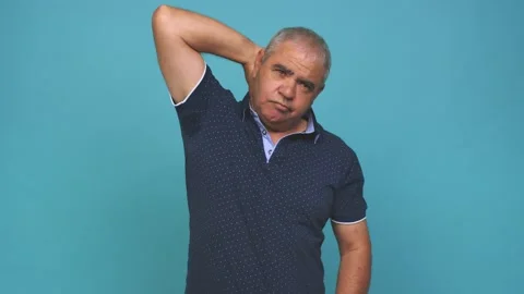 Senior man touching back of head, thinking and making a choice Stock Footage 144217558