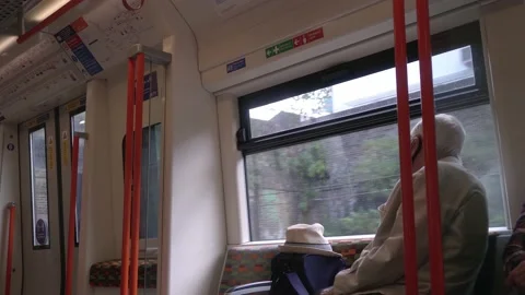 Senior man on train ride looking out the window during covid pandemic Stock Footage 170720614