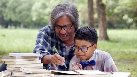Senior Man training Boy about artist skill at park. Stock Footage 96115603