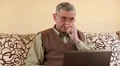 Senior man types text using laptop HD Footage
