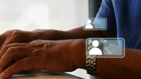 Senior man typing on keyboard and sorting contacts, tech profile icons Stock Footage 333368800