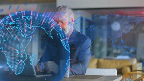 Senior man typing at laptop, analyzing, tech globe sweeping screen, receding as Stock Footage 334316111