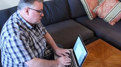 Senior Man Typing on a Laptop Stock Footage 49501797