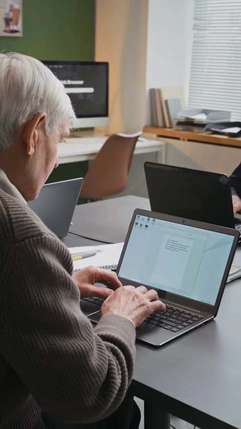 Senior Man Typing Text in Computer Class Vertical Stock Footage 333707516