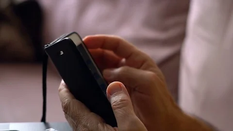 Senior Man Using Cellphone Video stock 78545317