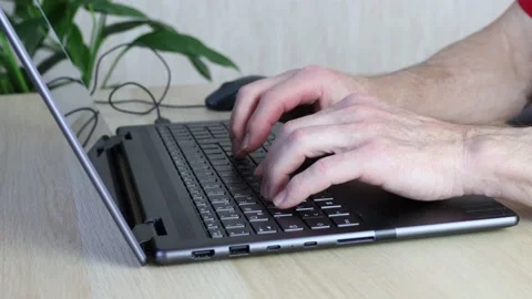 Senior man using computer. Hands typing on laptop keyboard. Stock Footage 239408447