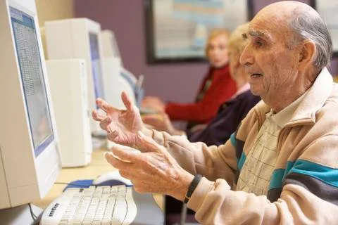 Senior man using computer Stock Photos
