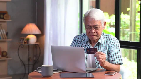 Senior man using credit card for online shopping Stock Footage 146204291