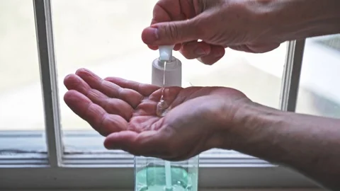 Senior Man Using Hand Sanitizer Stock Footage 126119205