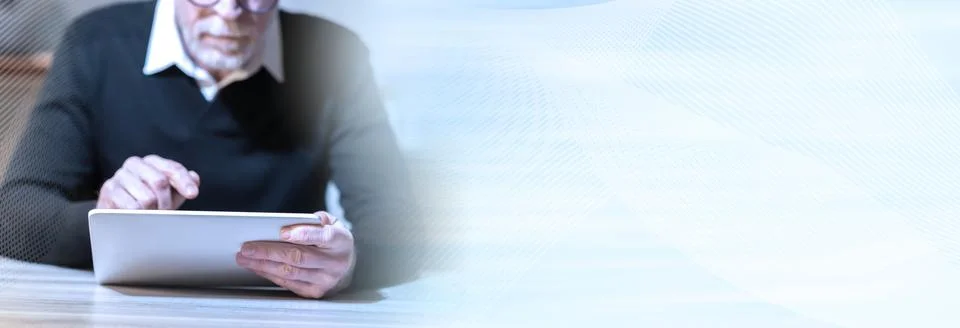 Senior man using his tablet; panoramic banner Stock Photos
