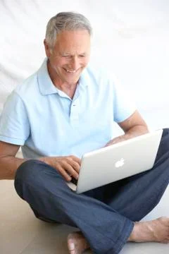 Senior man using laptop computer 스톡 사진