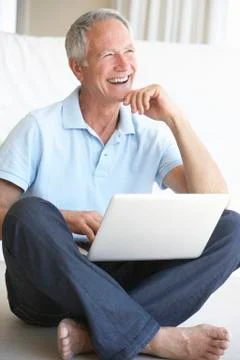 Senior man using laptop computer 스톡 사진