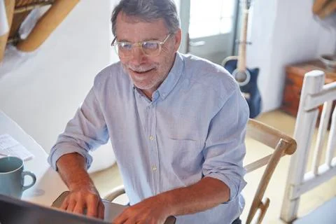 Senior man using laptop Stock Photos