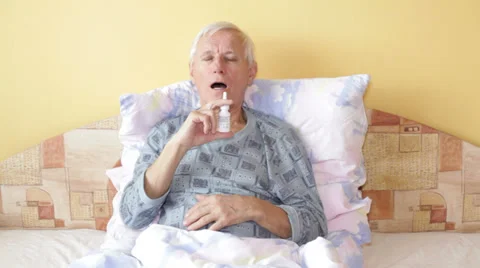 Senior man using nasal spray 動画素材 33741128