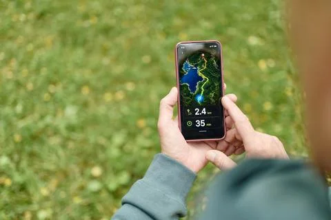 Senior Man Using Navigation Map App on Smartphone Outdoors Stock Photos