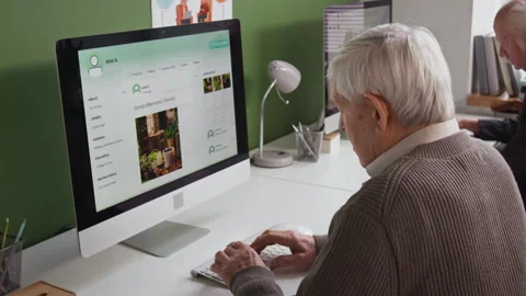 Senior Man Using PC in Computer Literacy Class Stock Footage 333755388