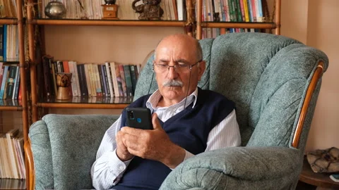 Senior man using smart phone for communicate  with his children Stock Footage 131847089