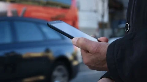 Senior Man Using SmartPhone with City Movement on Background 스톡 동영상 70963619