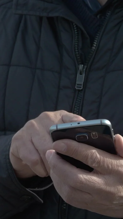 Senior Man Using Smartphone For Online Messaging. Vertical Stock Footage 272179398