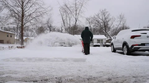 Senior Man Using SnowBlower After a Snowstorm Stock Footage 171188397