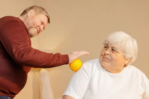 Senior Man Using Spiky Massage Ball for Shoulder Pain Relief and Muscle The.. Stock Photos
