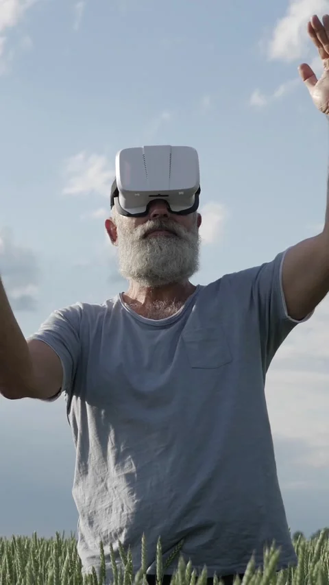 Senior Man With Virtual Reality Glasses Enjoying Digital Entertainment Video stock 303936243