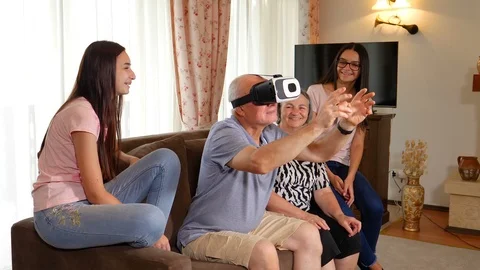 Senior man in virtual reality headset or 3d glasses having fun 스톡 동영상 94104332