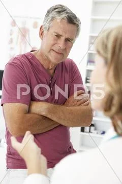 Senior man visiting doctor Stock Photos