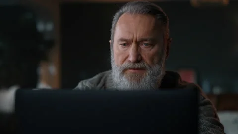 Senior man working computer cabinet. Old businessman using laptop home. Stock Footage 160423724