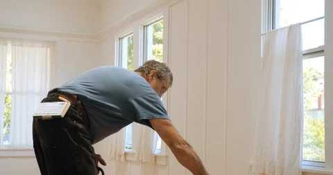 Senior man working on a floor. 스톡 동영상 88375770