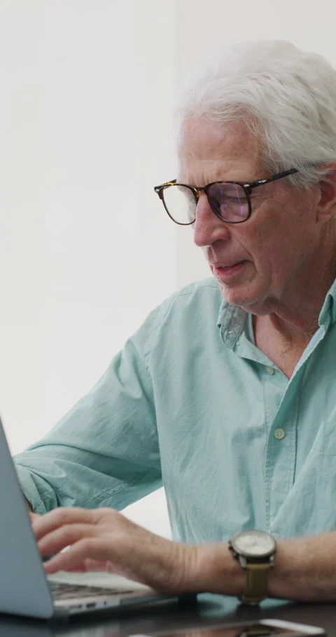 Senior man, writer and typing with laptop in home for online story, publish or Stock Footage 335107583