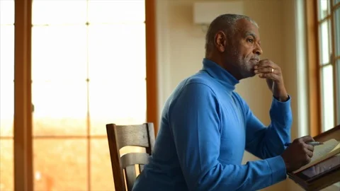 Senior man writing notes. 動画素材 88405893