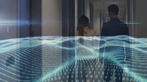 Senior manager and junior associate walking down corridor, showing tech binary Stock Footage 307432985